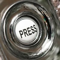 Close up of ceramic door press button Close up of ceramic door press button