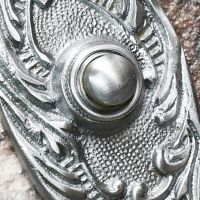 Close up of satin chrome finish and bell button Close up of satin chrome finish and bell button