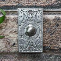 Satin Chrome Bell push on brick wall