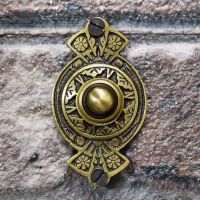 Antique Brass door bell on brick wall Antique Brass door bell on brick wall