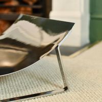 Close-up of the Bright Chrome Finish on the Curved Contemporary Log Holder Close-up of the Bright Chrome Finish on the Curved Contemporary Log Holder