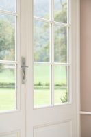 Bright Chrome Hammered Slimline Lever Door Handle in Situ Bright Chrome Hammered Slimline Lever Door Handle in Situ