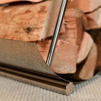 Close-up of the Bright Chrome Moon Log Holder Golding Logs