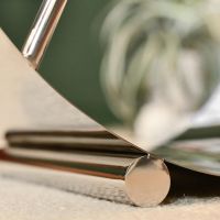 Close-up of the Base of the Bright Chrome Moon Log Holder