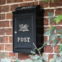 Bright Chrome Welsh Dragon Post Box on Wall