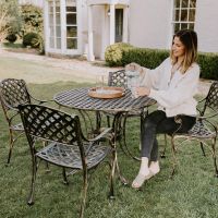 Brushed Gold "Chigwell" Circular Four Seater Table & Chair Set in Garden Setting  Brushed Gold "Chigwell" Circular Four Seater Table & Chair Set in Garden Setting