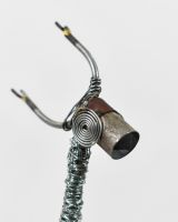 Close up of face detail on recycled metal art sculpture