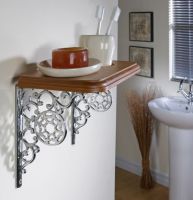 Spiders web wall bracket holding up shelf Spiders web wall bracket holding up shelf