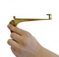 Glass shelf bracket finished in Brass in hand