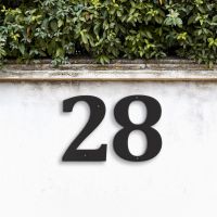 Black Individual House Numbers - Cambria Font on garden wall