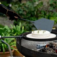 Camembert Cooking On Fire Paddle 