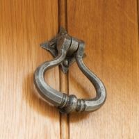 "Capulet" Pewter Shakespeare Door Knocker On A Light Brown Door "Capulet" Pewter Shakespeare Door Knocker On A Light Brown Door