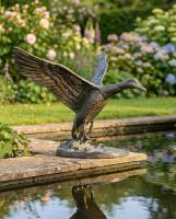 Cast Aluminum "Volans" Flying Duck Garden Sculpture ai illustration