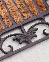 Close-Up of Cast Iron Frame on Two-in-One Boot Scraper and Doormat Close-Up of Cast Iron Frame on Two-in-One Boot Scraper and Doormat