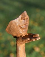 Close Up Of Rustic Cast Iron Blowing a Kiss Garden Sculpture