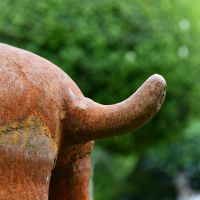 Tail on the Cast Iron Boxer Dog Sculpture