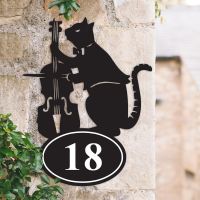 Bespoke Cat & Fiddle Iron House Number Sign on a Garden Wall
