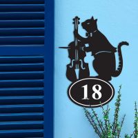 Iron Cat & Fiddle House Number Sign in Situ on a Blue Wall 