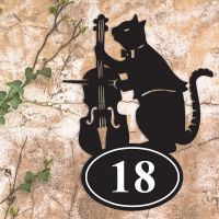 Cat & Fiddle Iron House Number Sign in Situ on a Rustic Wall 