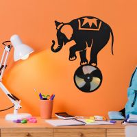 CD Elephant On Ball On Orange Background