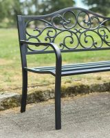 Close up of side detail on classic back outdoor two seater bench Close up of side detail on classic back outdoor two seater bench