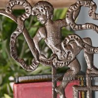 Close-up o the Cherub Design on the Shelf Bracket