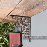 Cherub Iron Shelf Bracket Holding up a Wooden Shelf