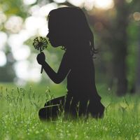 Girl With Flower Iron Silhouette in the Garden