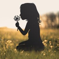 Girl With Flower Iron Silhouette in Situ in a Field