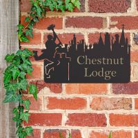 Chimney Sweep Iron House Name Sign in Use on a Brick Wall Chimney Sweep Iron House Name Sign in Use on a Brick Wall