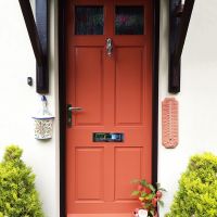 Squirrel Door Knocker on orange front door