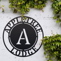 Circular Iron House Name Sign in Situ Outside
