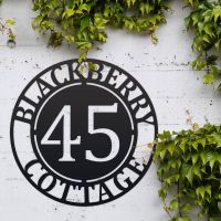 Circular Iron House Name Sign in Use Outside