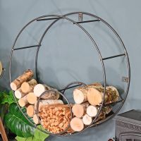 Circular Iron Wall Mounted Log Holder Holding Logs on a Blue Wall