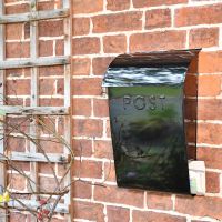 "Cityscape" Black Contemporary Post Box With Lock Holding a Newspaper