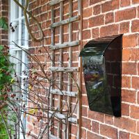"Cityscape" Black Contemporary Post Box With Lock and Newspaper Holder in Situ on the Front of a House