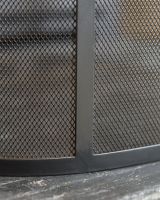 Close Up Of Classic Black Arched Fire Guard with Circular Handle Frame Close Up Of Classic Black Arched Fire Guard with Circular Handle Frame