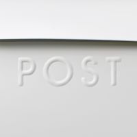 Close-up of the Embossed Lettering on the White Post Box