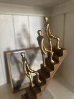 Close up of gold figure detail on interior ornament