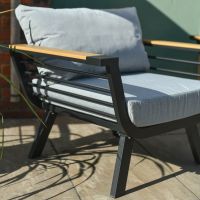 Close up of contemporary black frame on individual armchair outdoor lounge sets