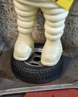 close up of base on Michelin man statue close up of base on Michelin man statue