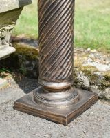 Close up of ornate base detail on garden column