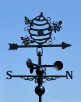 Close up of intricate detail on black garden weathervane