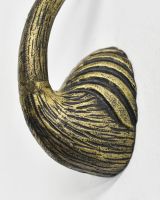 Close up of body detail on gold animal wall bust