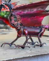 Close up of intricate body detail on recycled metal art sculpture