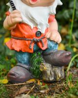 Close up of intricate clothes detail on garden gnome ornament