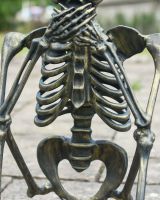 Close up of brushed gold skeleton outdoor sculpture