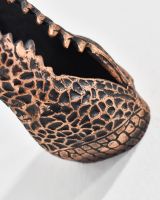 Close up of intricate crocodile scale details on safari animal wall bust