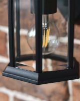 Close Up Of Bulb In Wall Light 