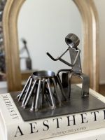 Close up of recycled metal tealight holder Close up of recycled metal tealight holder